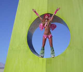 Beautiful Woman on Green Thing, Burning Man photo