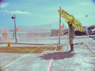Geoffrey Watering the Court, Burning Man photo